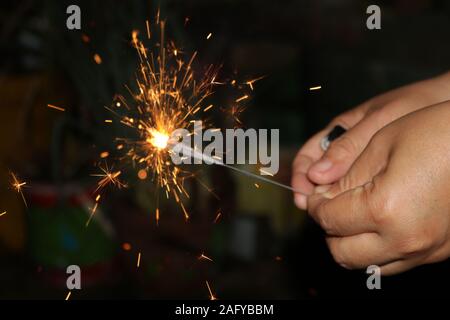 Small fireworks are lit at the new year's event Stock Photo