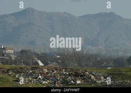 Trash dumped illegally on a city limit in Romania's countryside Stock Photo