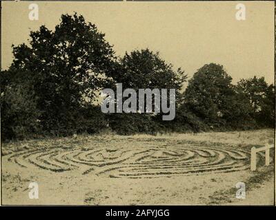 . Mazes and labyrinths; a general account of their history and developments. Fig. 56. Labyrinths on Tiles, Toussaints Abbey, Chalons-sur-Marne. (Ame) (sec page 65). Fig. 60. Turf-Labyrinth at Wing, Rutland.(Photo, W.J. Stocks. By permission of Rev. E. A. Irons) 4 ft. high. It may be that the frequent association of turfmazes with ancient earthworks of various kinds is some-thing more than accidental, but we do not seem to havesufficient evidence to establish a necessary connecldonbetween the two things. Lyddington, another Rutland village, has also beenmentioned as possessing a turf maze. A wr Stock Photo