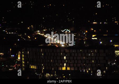 A city seen from above, at night, during the winter months. Stock Photo