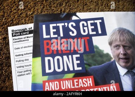 British general election 2019. Let's Get Brexit Done slogan on Conservative party leaflet on door mat with polling card. Stock Photo