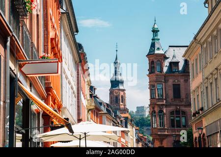 Old town Hauptstrasse main street and Heiliggeistkirche, Church of the Holy Spirit in Heidelberg, Germany Stock Photo