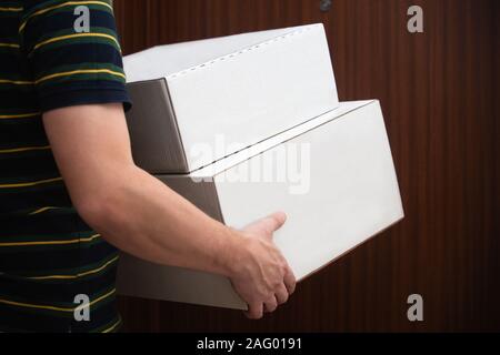 Man delivering boxes / packages. Stock Photo