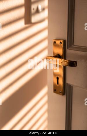 A old brass door handle. Stock Photo