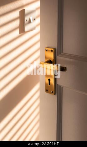A old brass door handle. Stock Photo