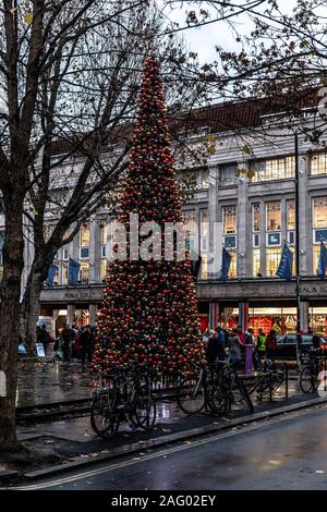 Giant Christmas tree decoration in Tottenham Court Rd., London, England, UK. Stock Photo