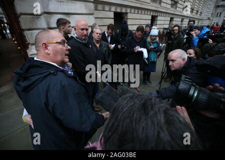Tim Dunn (left), the father of teenage motorcyclist Harry Dunn, who was killed when his motorbike crashed into a car outside RAF Croughton in Northamptonshire on August 27, talks to the media following a meeting, with other family members, at the Foreign and Commonwealth Office in Westminster, London, with Foreign Secretary Dominic Raab. Stock Photo