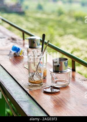 left over glasses of traditional Vietnamese coffee in Da Lat Stock Photo