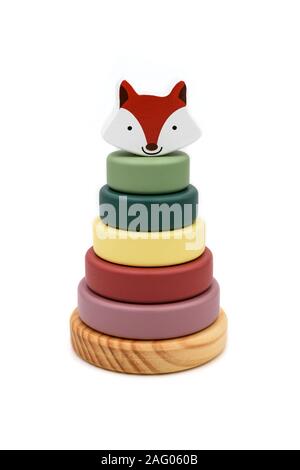 Wooden ring stacking toy with colored rings and a fox head on the top. Stock Photo