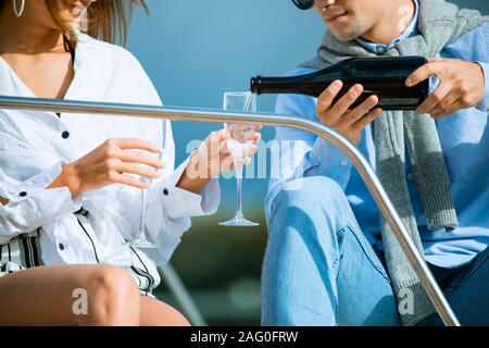 Two young tourists having fun on boat tour in the summertime Stock Photo