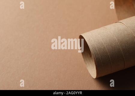 Rolled sheet on craft background, close up and space for text Stock Photo