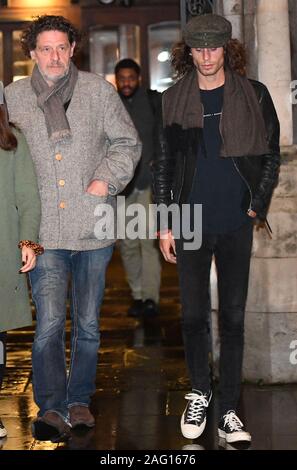 Marco Pierre White (centre right) leaves the Royal Courts of Justice in London accompanied by his children Marco White Jr (not pictured) and Luciano White (right), as the chef and his estranged wife Matilde are embroiled in a High Court row over money. Stock Photo