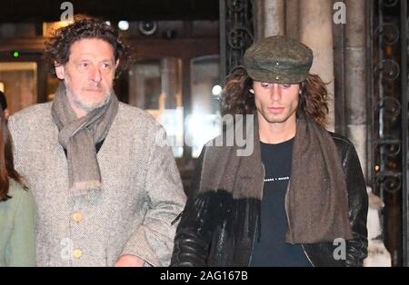 Marco Pierre White (centre right) leaves the Royal Courts of Justice in London accompanied by his children Marco White Jr (not pictured) and Luciano White (right), as the chef and his estranged wife Matilde are embroiled in a High Court row over money. Stock Photo