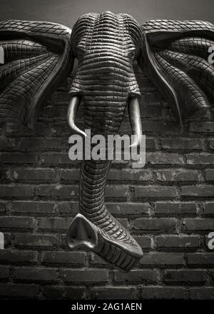 Big elephant head art statue on the brick wall d'riam riverside resort Bandung Indonesia