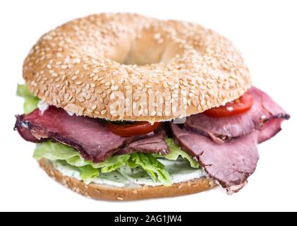 Fresh made Bagel with meadium grilled Roast Beef (selective focus) isolated on white background Stock Photo