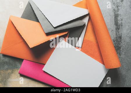 Various colors envelopes with greeting cards on the table Stock Photo