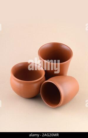 Close-up of Clay pots on cream color background Stock Photo