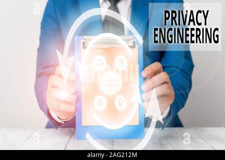 Writing note showing Privacy Engineering. Business concept for engineered systems provide acceptable levels of privacy Stock Photo