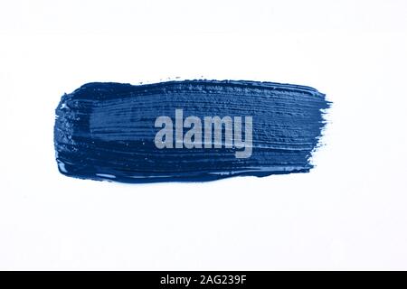 Blue stroke of the paint brush isolated on white. Classic blue color of year 2020 Stock Photo