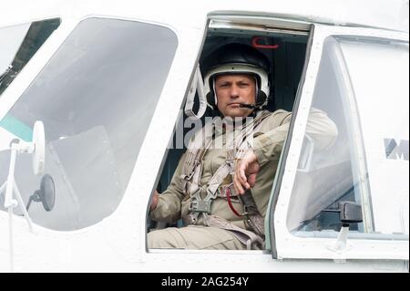 Pilot before flight in MI-8 helicopter Stock Photo - Alamy