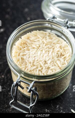 Uncooked indian long rice in jar. Stock Photo