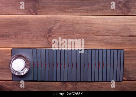 Fortune telling cards on a wooden table. Top view, place for text. Runic cards. Stock Photo