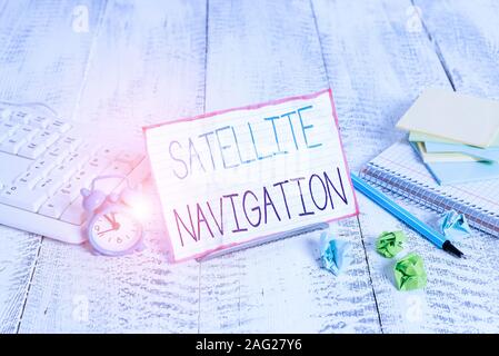 Word writing text Satellite Navigation. Business photo showcasing system providing autonomous geospatial positioning Notepaper stand on buffer wire in Stock Photo