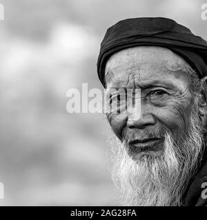 Old man with long beard, in Hoang Su Phi, Ha Giang province, in the mountainous northwestern part of Vietnam. Stock Photo