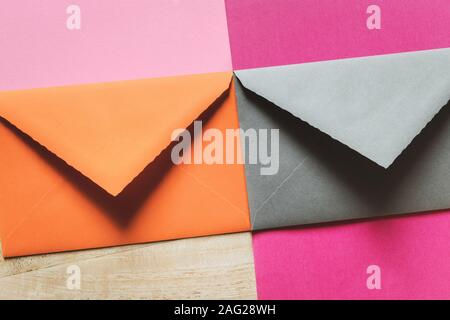 Two envelopes and greeting cards on the wooden table Stock Photo