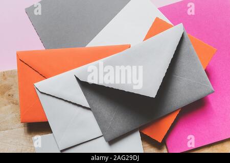 Various colors envelopes and greeting card on the table Stock Photo