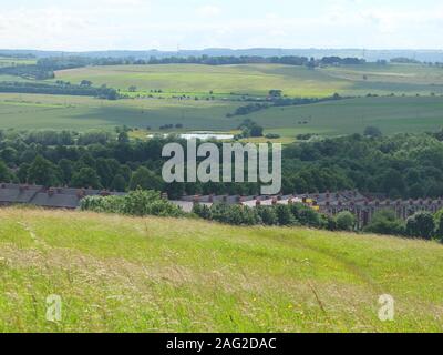 View of New Bolsover Model Village (known as 'The Model'), Carr Vale Flash nature reserve beyond and surrounding countryside viewed from Hill Top Stock Photo