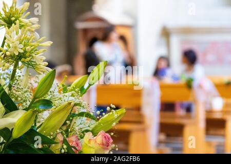Flowers with liturgical celebration background, god, religion, ceremony Stock Photo
