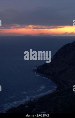 Dark, overcast sunset over the Mediterranean sea, in Terracina, Italy. Stock Photo