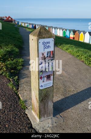 Herne Bay, UK - Dec 11 2019  A sign asking people to share the path between dog walkers, cyclists, pedestrians and wheel chairs along the coast in Her Stock Photo