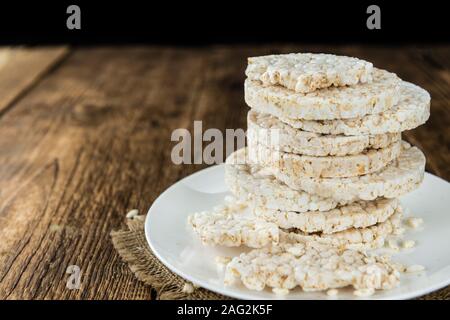 Some Rice Cakes (close-up shot) on an old wooden table Stock Photo