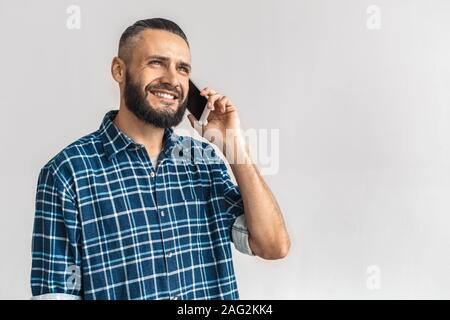 Mature bearded man call on modern smartphone Stock Photo