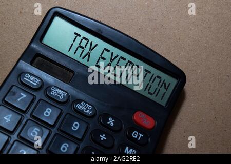 Tax Exemption write on calculator isolated on white board background. Stock Photo