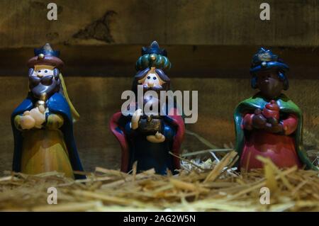 Christmas nativity scene of baby Jesus in the manger. Statuettes colored figures Stock Photo