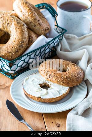 Multigrain bagel with cream cheese. Stock Photo