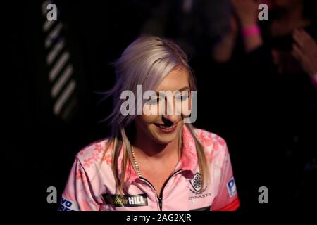 Fallon Sherrock during the walk on during day five of the William Hill World Championships at Alexandra Palace, London. Stock Photo