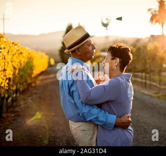 Senior couple dancing in the vineyard. Stock Photo