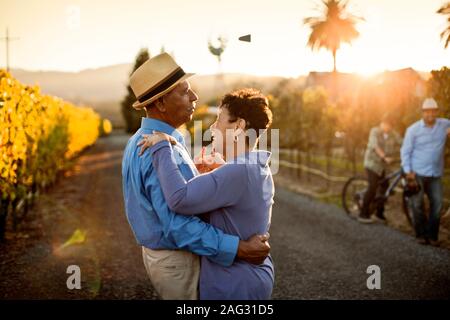 Senior couple dancing in the vineyard. Stock Photo