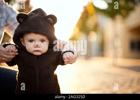 Portrait of baby boy wearing a bear suit. Stock Photo