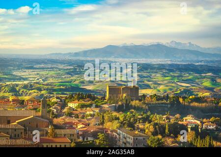 Tuscany, Volterra panoramic view landscape and San Giusto Nuovo medieval church at sunset. Italy, Europe Stock Photo