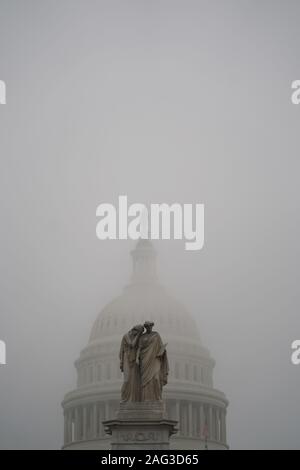 Washington, USA. 17th Dec, 2019. The Capitol Hill is shrouded in fog in Washington, DC, the United States, on Dec. 17, 2019. U.S. President Donald Trump on Tuesday sent a six-page letter to House Speaker Nancy Pelosi, slamming the House Democrats impeachment effort as an 'illegal, partisan attempted coup' and an 'unprecedented and unconstitutional abuse of power.' Credit: Liu Jie/Xinhua/Alamy Live News Stock Photo