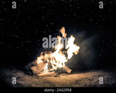Horizontal shot of a bonfire at night time under the beautiful starry sky Stock Photo