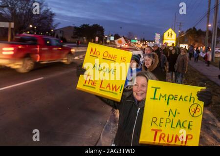 Rochester Hills, Michigan, USA - 17 December 2019 - Several hundred protesters, almost all white, urged the impeachment of President Trump. They were outside the office of Rep. Elissa Slotkin, a Democrat elected in 2018 to represent a district that voted for Trump in 2016. The rally was one of more than 500 pro-impeachment rallies scheduled in all 50 states. Credit: Jim West/Alamy Live News Stock Photo