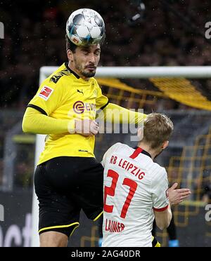 Dortmund, Germany. 17th Dec, 2019. Mats Hummels (Top) of Dortmund vies with Konrad Laimer of Leipzig during a German Bundesliga match in Dortmund, Germany, Dec. 17, 2019. Credit: Joachim Bywaletz/Xinhua/Alamy Live News Stock Photo