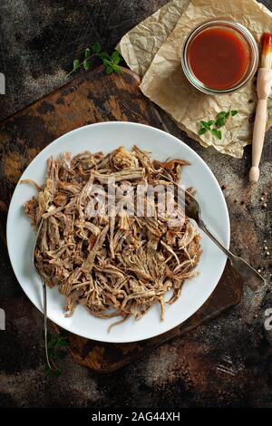 Pulled pork with forks on a plate Stock Photo