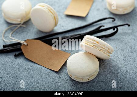 Vanilla macarons on a gray surface Stock Photo